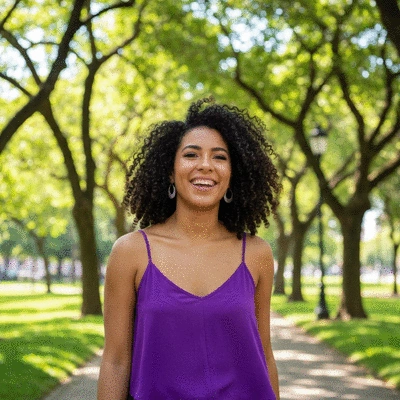 Person engaging in a low-impact exercise outdoors, smiling and enjoying the activity, representing a sustainable routine
